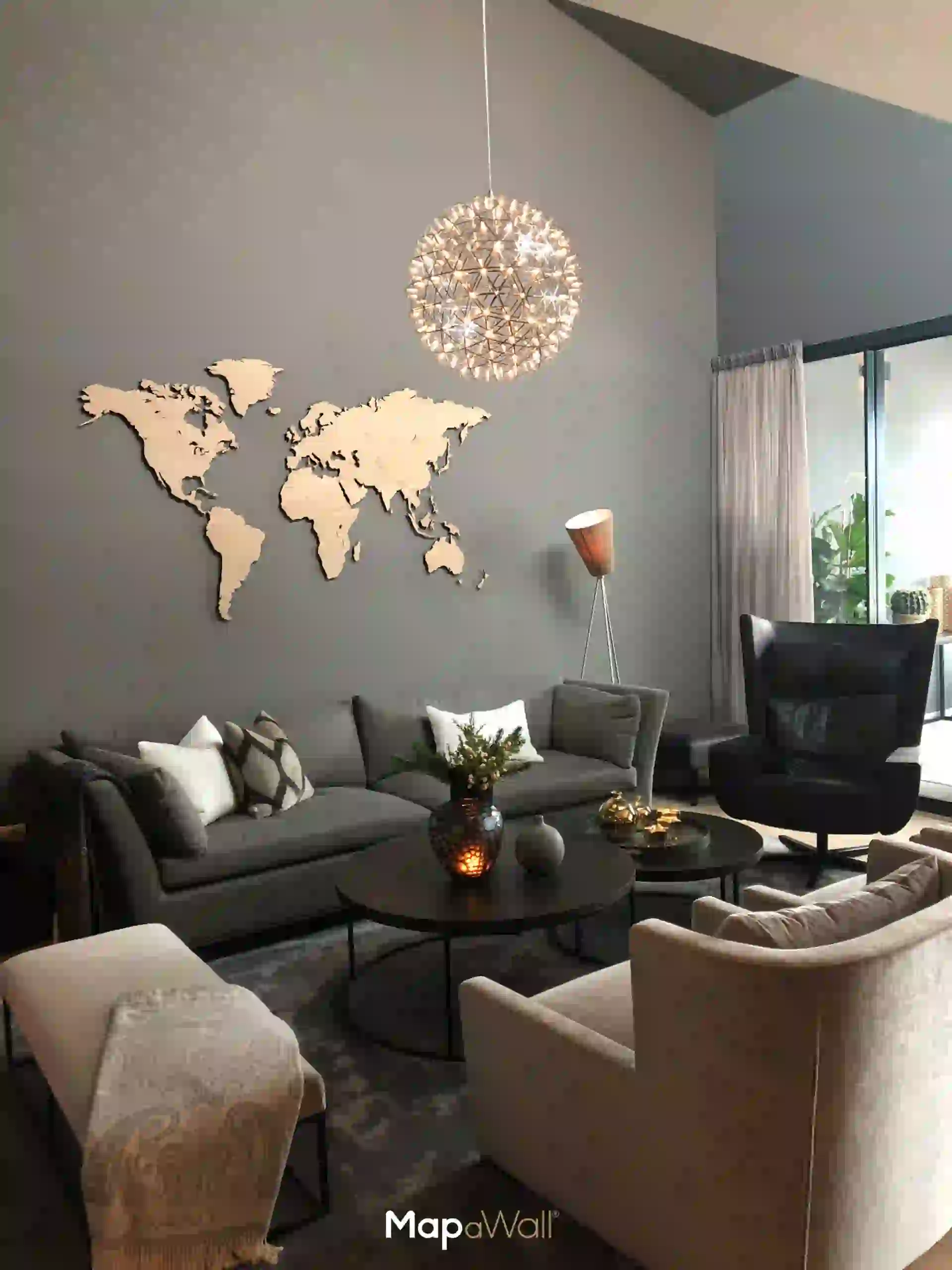 A magnetic MapaWall European Oak world map untreated with country borders, installed in a modern Scandinavian interior
