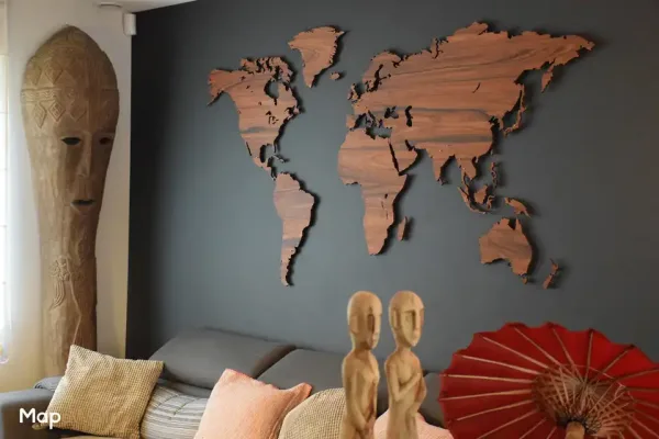 Magnetic MapaWall Rosewood Santos world map with cylindrical pin-magnets installed on a black wall