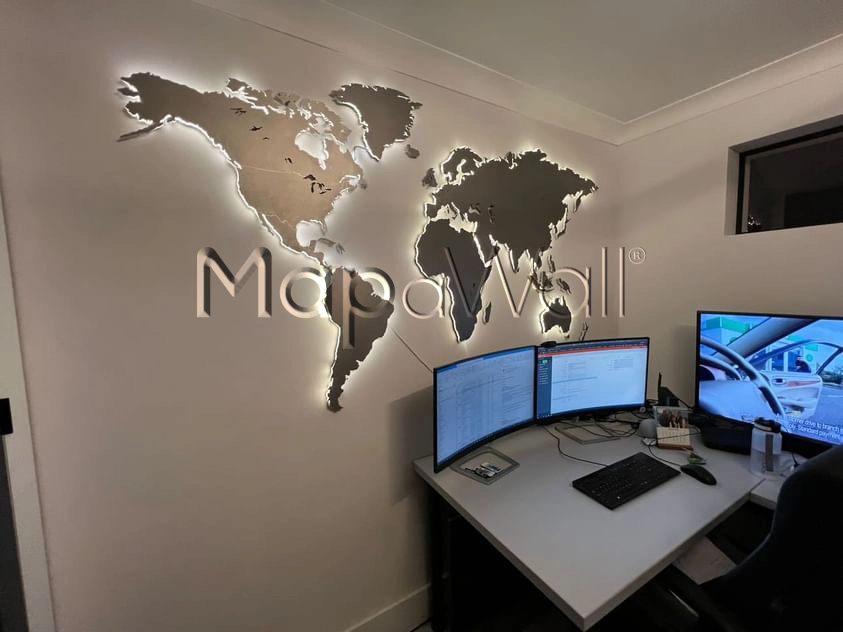 LED Illuminated stainless steel world map installed in home office